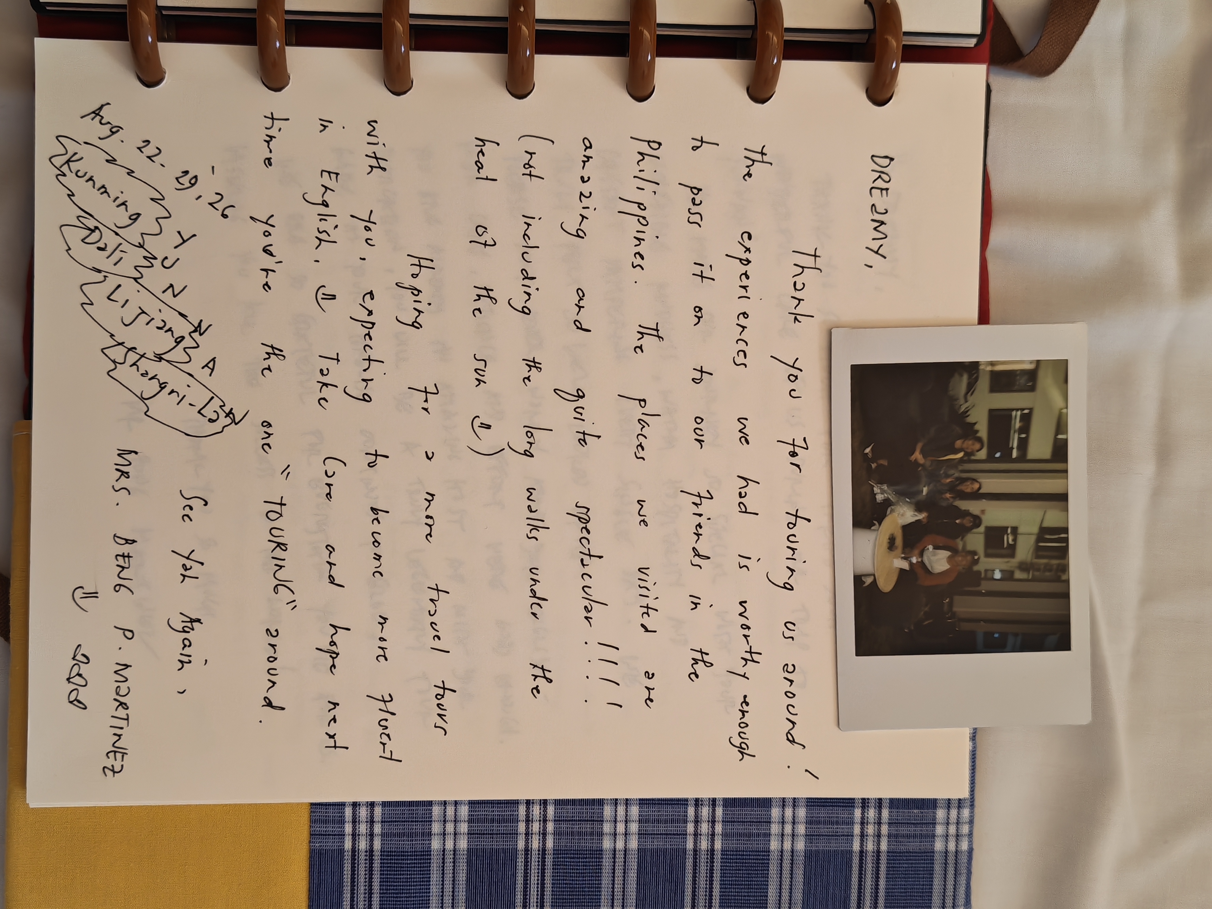 A handwritten thank-you note and instant photo from guests