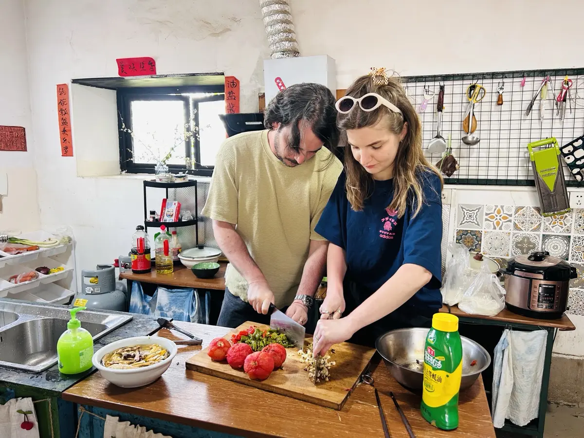 Guests cooking together in Shaxi